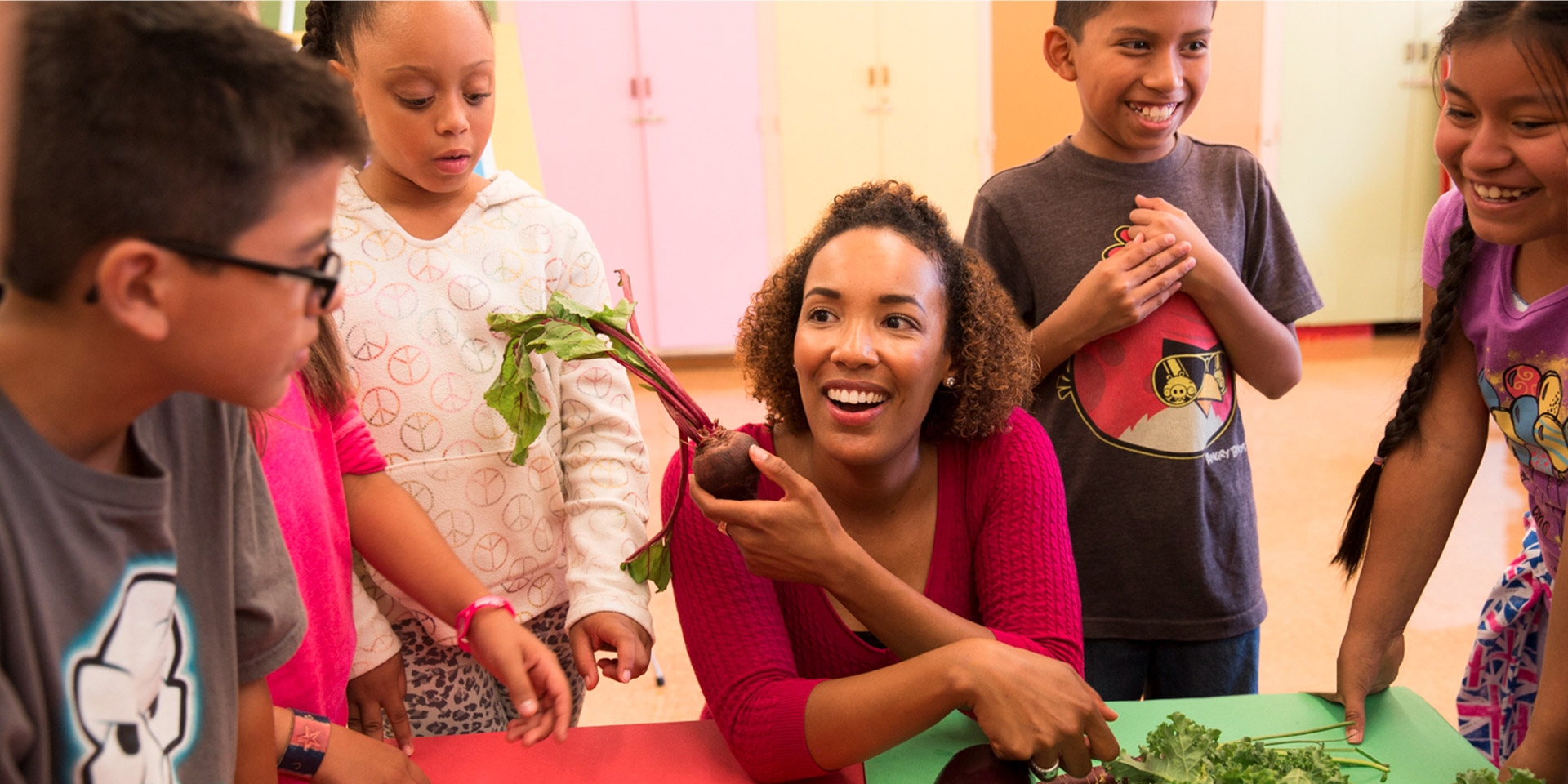 A K-12 teacher uses vegetables to engage students